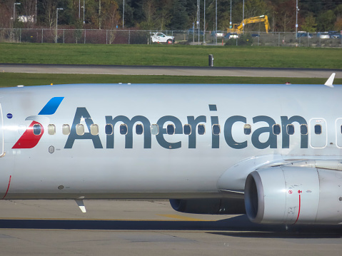 Vancouver, BC, Canada. Nov 28, 2023. A close up to an American Airlines logo on a plane at the International Airport of Vancouver.