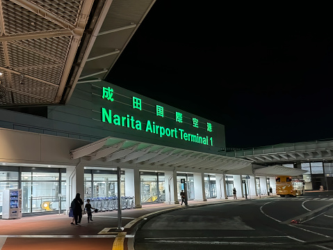 Narita, Chiba, Japan. Oct 30, 2023. Main entrance of the Narita International Airport at night.