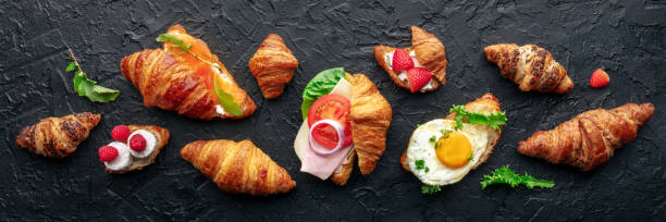 istock Croissant sandwich set panorama. Different stuffed croissants, overhead 1830664893