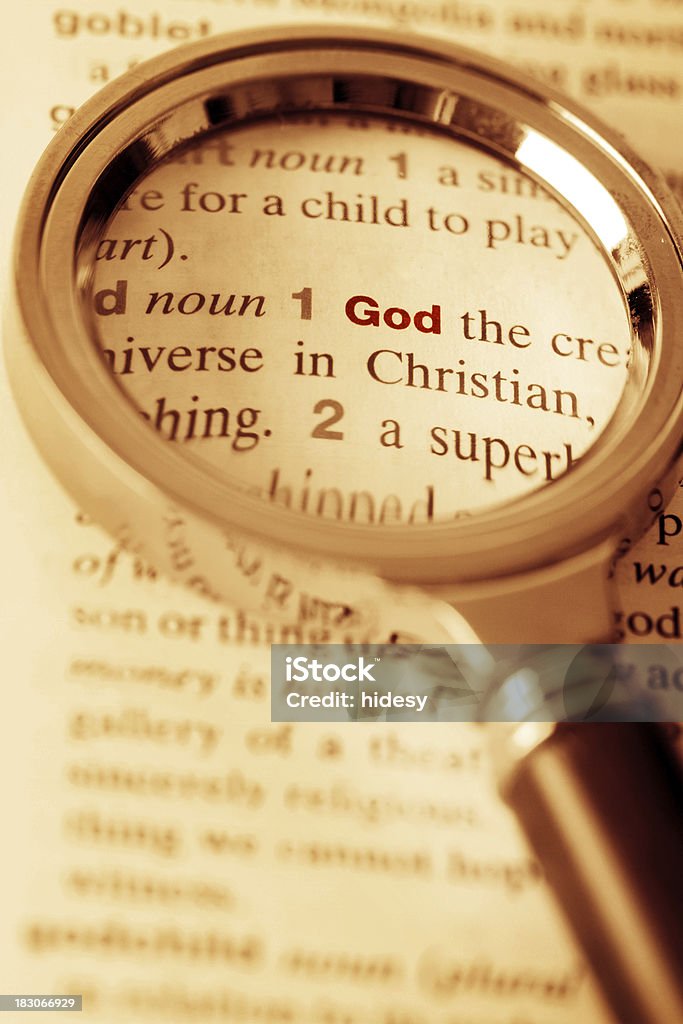 God Under the Magnifying Glass Definition of God under the magnifying glass in a dictionary Analyzing Stock Photo