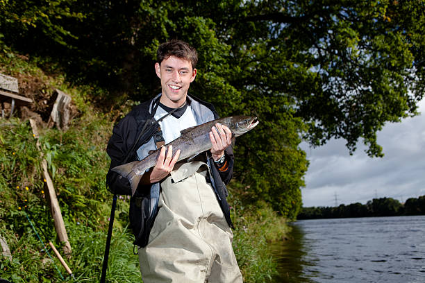 first salmon Youths first Salmon fly fishing scotland stock pictures, royalty-free photos & images