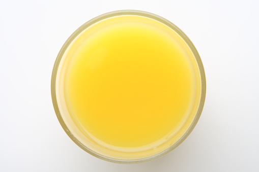 Glass of orange juice from above