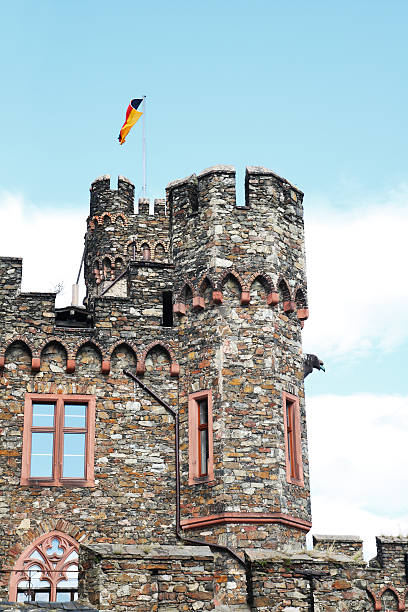 Tower of Reichenstein castle with german flag stock photo