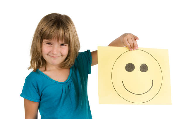 istock Girl holds hand-drawn smiley face 183068343
