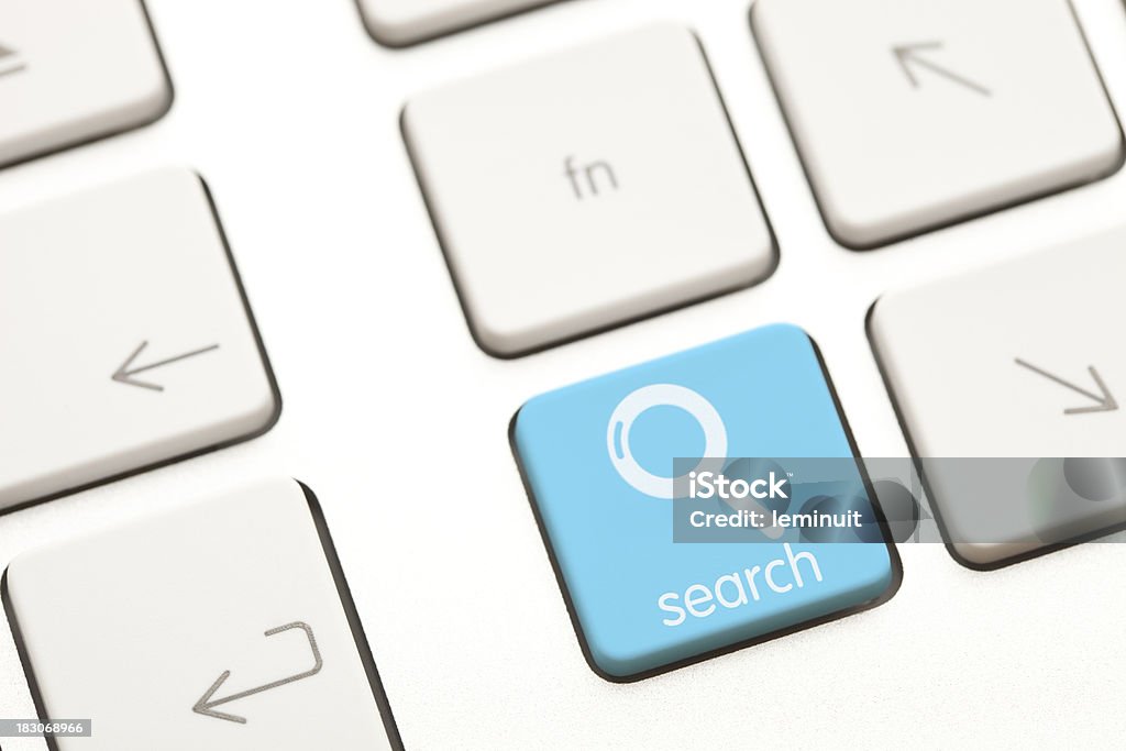 Search computer key Search blue computer key with a magnifying glass icon on it. This is an exclusive image and it can only be found in iStockphoto. Blue Stock Photo