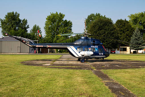 Siofok, Hungary - July 23, 2016: Hungarian government police helicopter at airport and airfield. Rotorcraft. General aviation industry. Police utility transportation. Air transport. Fly and flying.