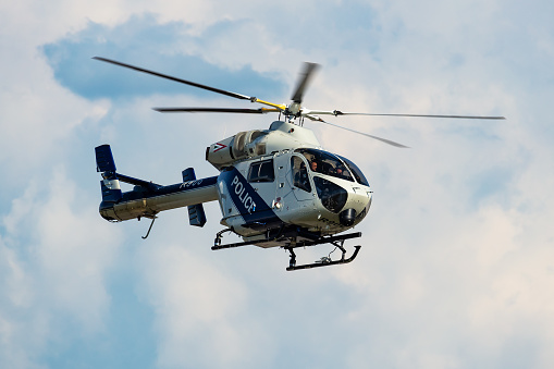 Siofok, Hungary - August 3, 2021: Government police helicopter at airport and airfield. Rotorcraft. General aviation industry. Police utility transportation. Air transport. Fly and flying.