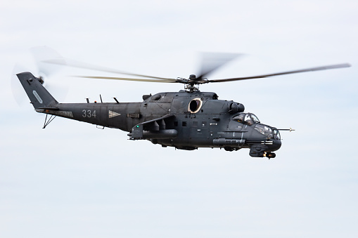 Budapest, Hungary - August 20, 2021: Hungarian Mil Mi-24 military attack helicopter at air base. Air force flight operation. Aviation and Air defense. Military industry. Fly and flying.