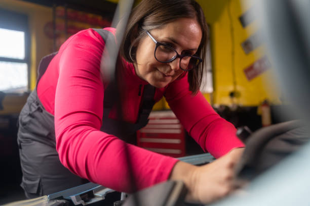 istock Mechanic woman fixing car engines 1830694736