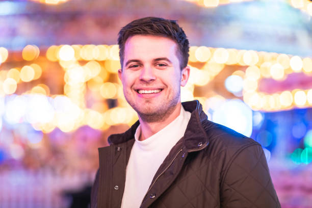 istock Smiling man portrait at amusement park looking at camera and smiling 1830696996