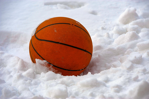 A basketball in the snow... the end of a season