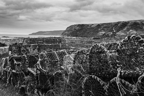Lobster pots on a weathered quayside