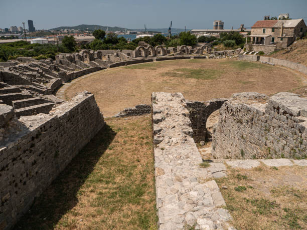 The amphitheatre of Salona The ruins of Salona’s amphitheatre in warm summer light salona croatia split dalmatia stock pictures, royalty-free photos & images