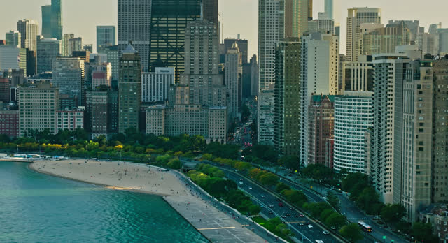 Aerial Shot of Lake Shore Drive and Oak Street Beach in Chicago at Sunset