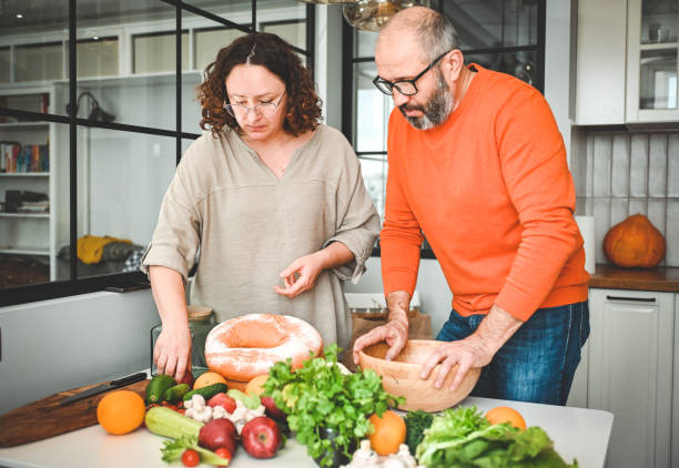 istock husband and wife cooking in the kitchen 1830736914