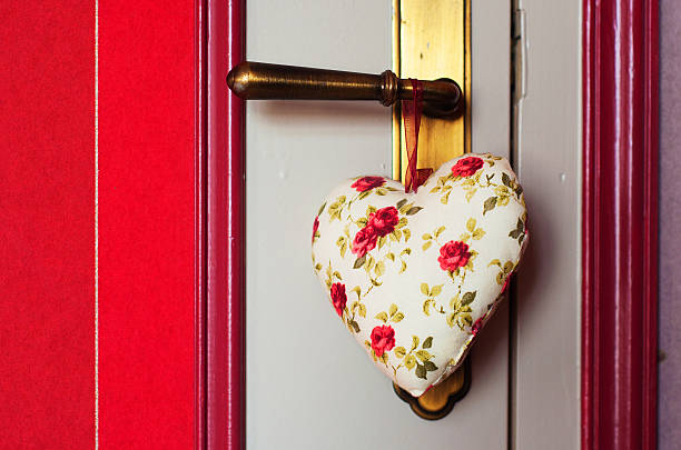 istock fabric heart hanging on the doorknob 183075182
