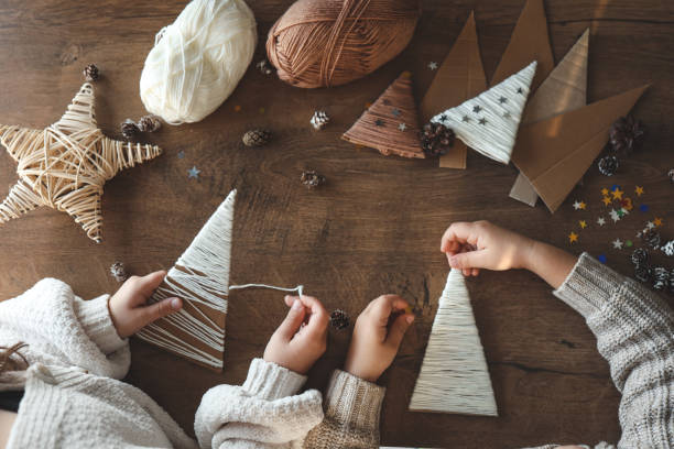 istock Children making Christmas decorations from yarn 1830768664