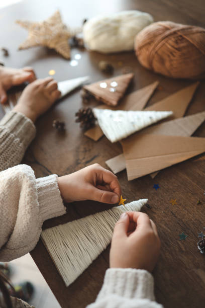 istock Children making Christmas decorations from yarn 1830768675