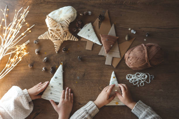 istock Children making Christmas decorations from yarn 1830768687