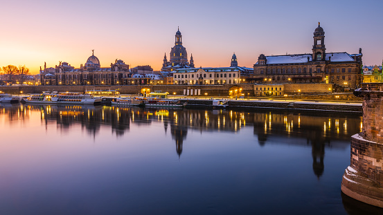 The historical waterfront with baroque buildings in Dresden early in the winter dawn.