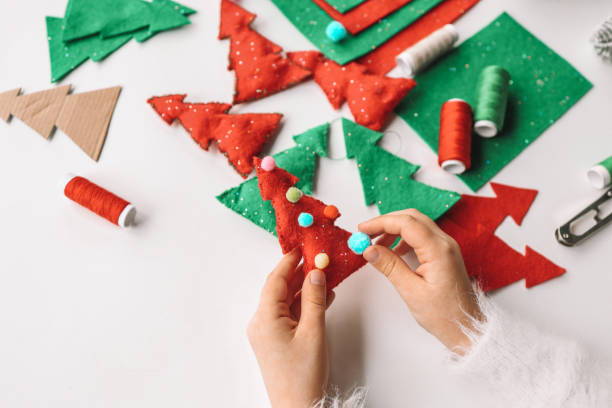 istock Process of hand made soft toys sewing with felt and needle for Christmas tree decoration 1830772005