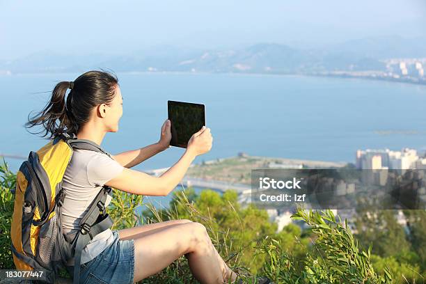 Young Woman Hiker Use Digital Tablet Outdoor Stock Photo - Download Image Now - Adult, Adults Only, Asian and Indian Ethnicities