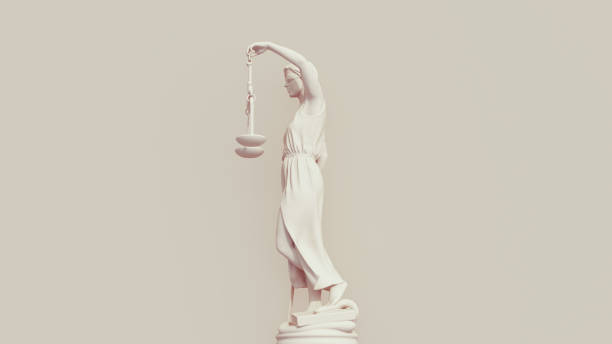 istock Lady justice judicial system scales blindfold sword neutral background soft tones beige brown left side view 1830775504