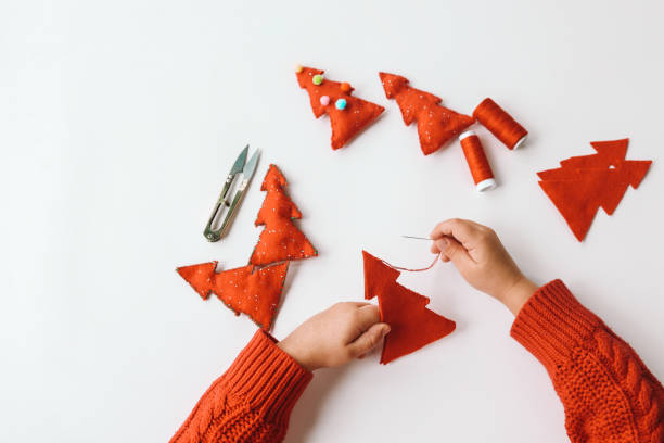istock Process of hand made soft toys sewing with felt and needle for Christmas tree decoration 1830776859