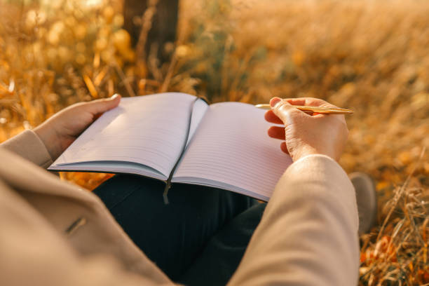istock Girl with paper planner outdoors, autumn concept 1830782501