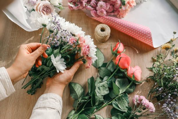 istock Florist at work. Woman making autumn floral decorations 1830782522