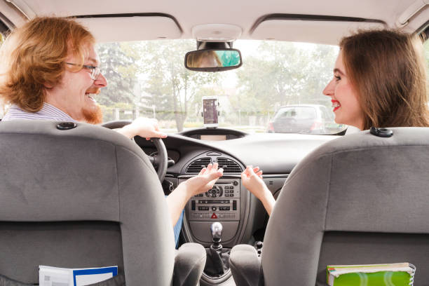 istock Happy man and woman in car 1830789048