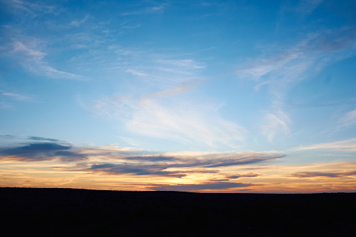 a very dramatic sunset in the desert