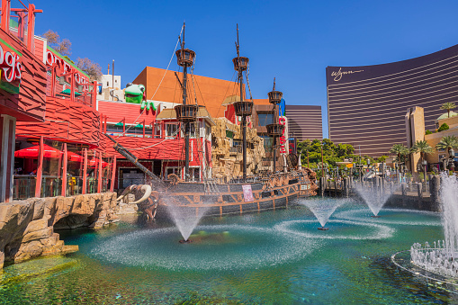 Las Vegas. USA. 09.25.2023. Beautiful view of Treasure Island Hotel Casino with fountains and pirate ship on Las Vegas Strip. USA. 09.25.2023.