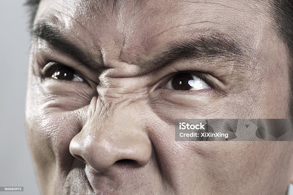 Extreme Close up on enojado mans cara - Foto de stock de Adulto libre de derechos