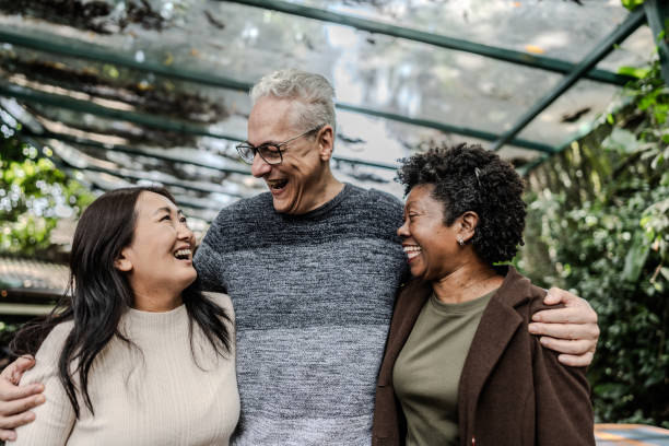 istock Happy friends embracing 1830852125