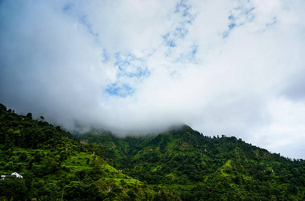 istock clouds rolling over the green hills of shimla 183085337