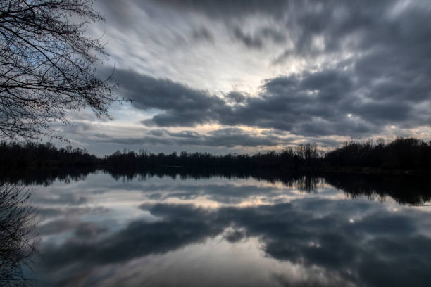 istock Golden lake sunset panorama / Panoramic view with lake sunset 1830867054