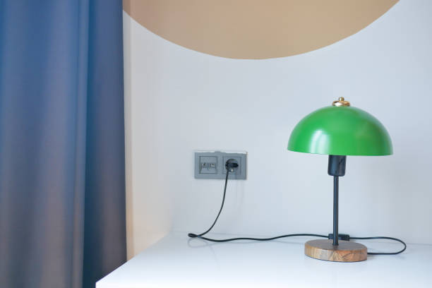 istock table lamp against orange color wall in bed room 1830888624