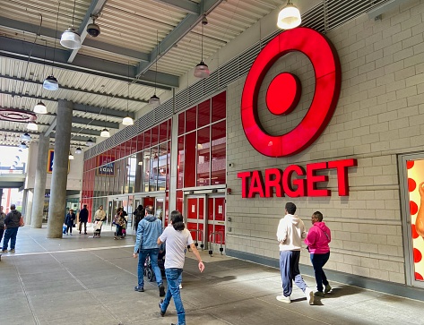 New York, NY USA - September 27, 2023 : People walking in front of the facade and entrance of the Target store on the second floor of the East River Plaza shopping mall in East Harlem, New York City