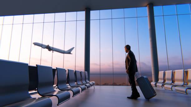 Airport lounge A businessman watching airplane in airport lounge airport stock pictures, royalty-free photos & images