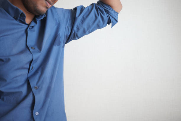 istock man with wet armpits Smelly odor from sweat . 1830891566