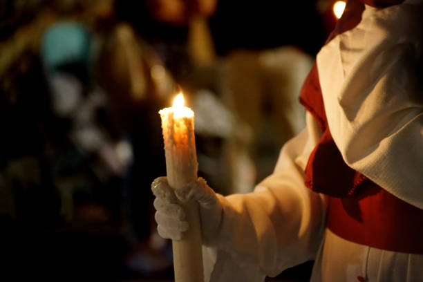 istock A penitent with his candle on the holy night 1830909006