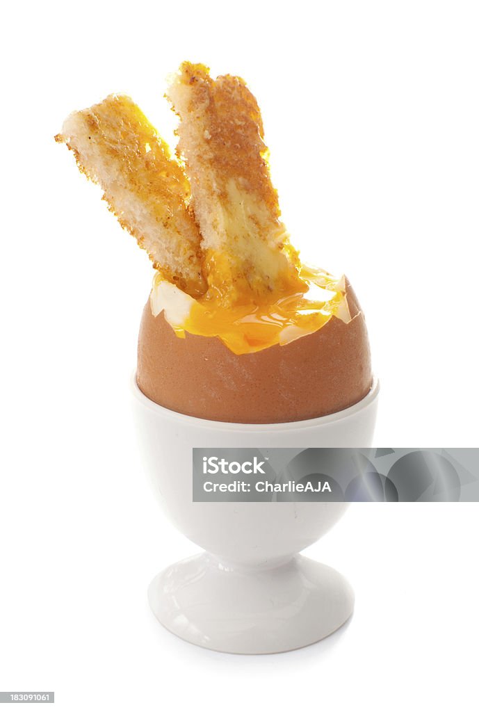 Hash Brown patties dipped in a cracked boiled egg Toasted soldiers dipped in soft boiled egg  Boiled Egg Stock Photo