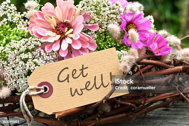 Arrangement Of Flowers And Twigs With Get Well Message Stock Photo - Download Image Now