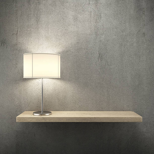 istock Bookshelf on the wall with lamp 183092075