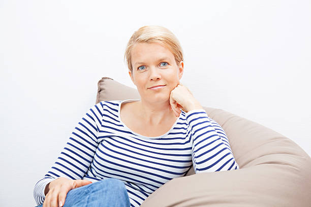 istock Woman sitting on a beanbag 183092441