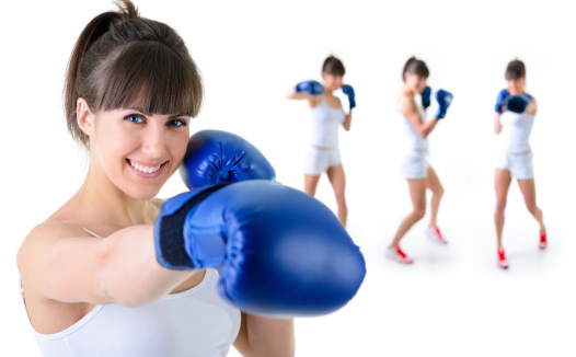 sport girl in boxing gloves with training fitness women in background, over white background