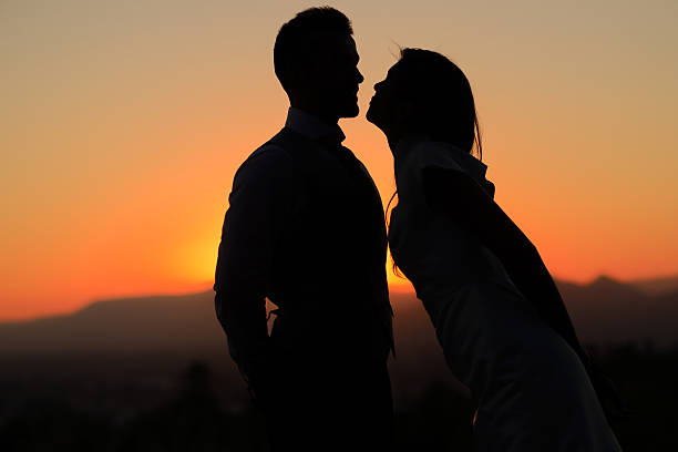 istock Just married couple kissing in the sunset 183094828
