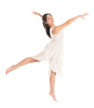 Modern Asian contemporary dancer poses in front of the studio background, full length isolated white.