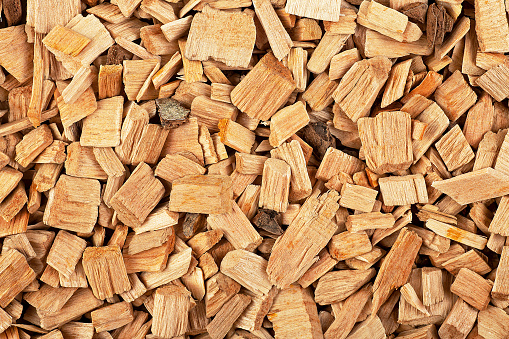 Wood chips background, top view. Natural material. Wood chips for smoking.